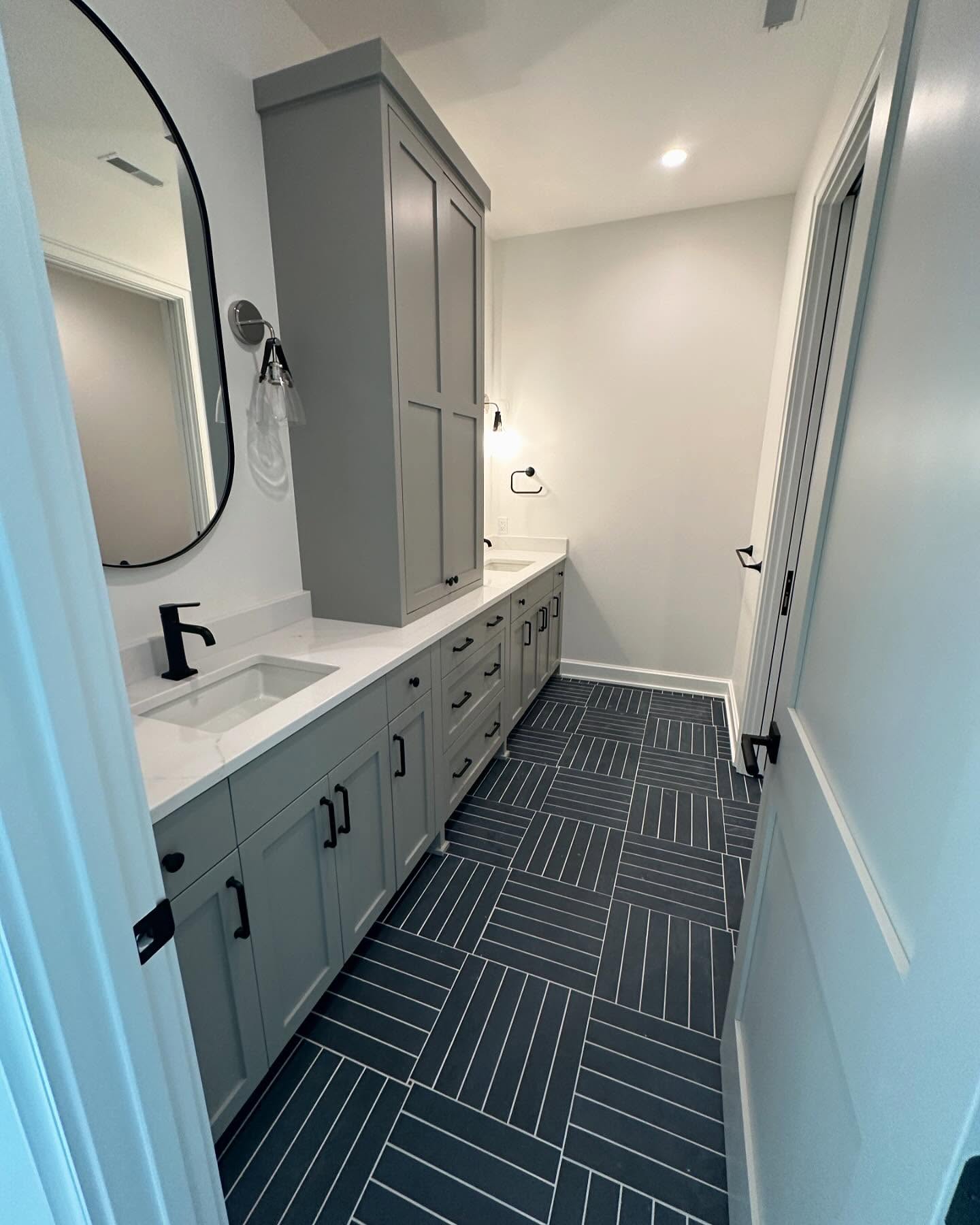 Navy herringbone bathroom wall tile