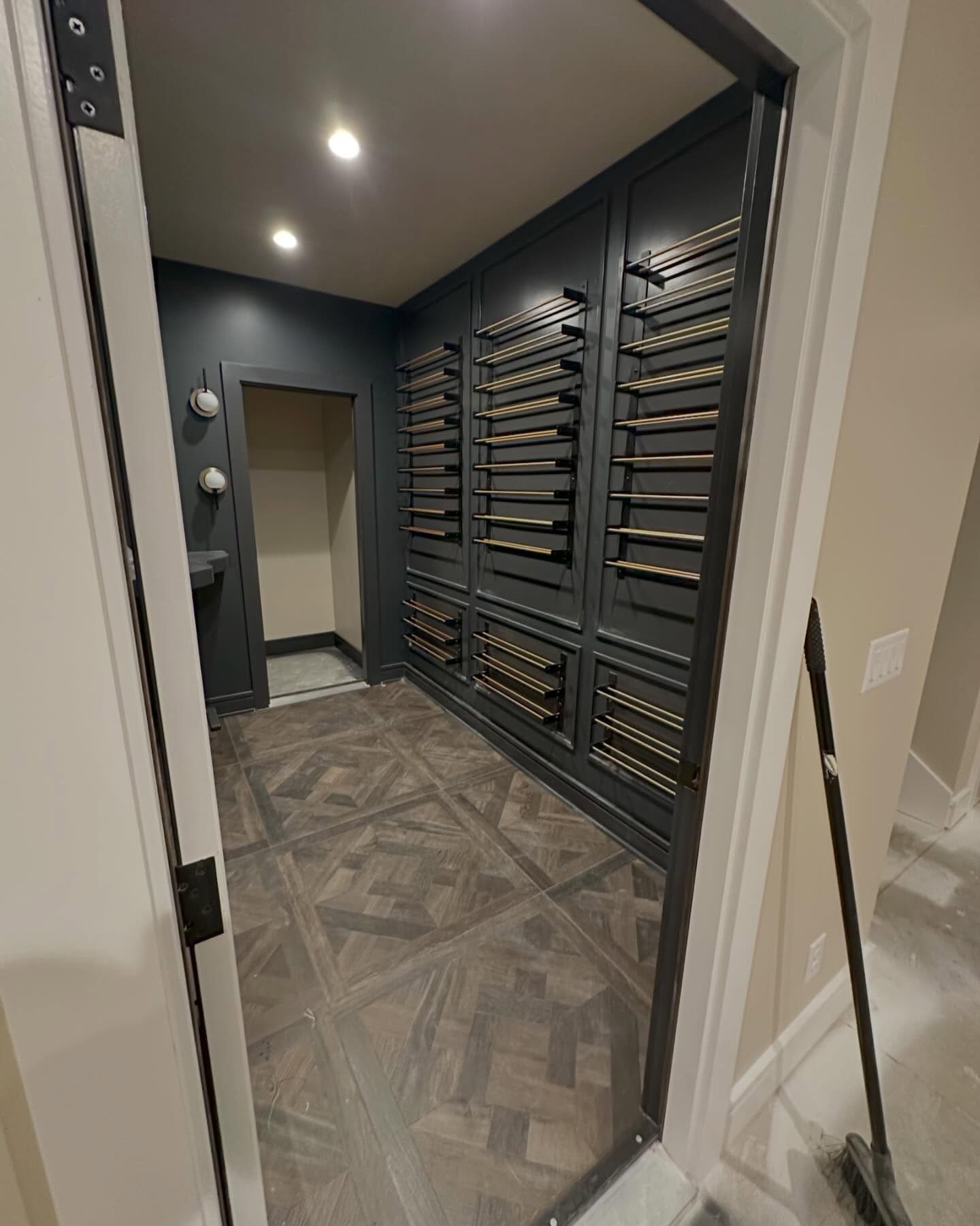 Wine room with parquet tile floor